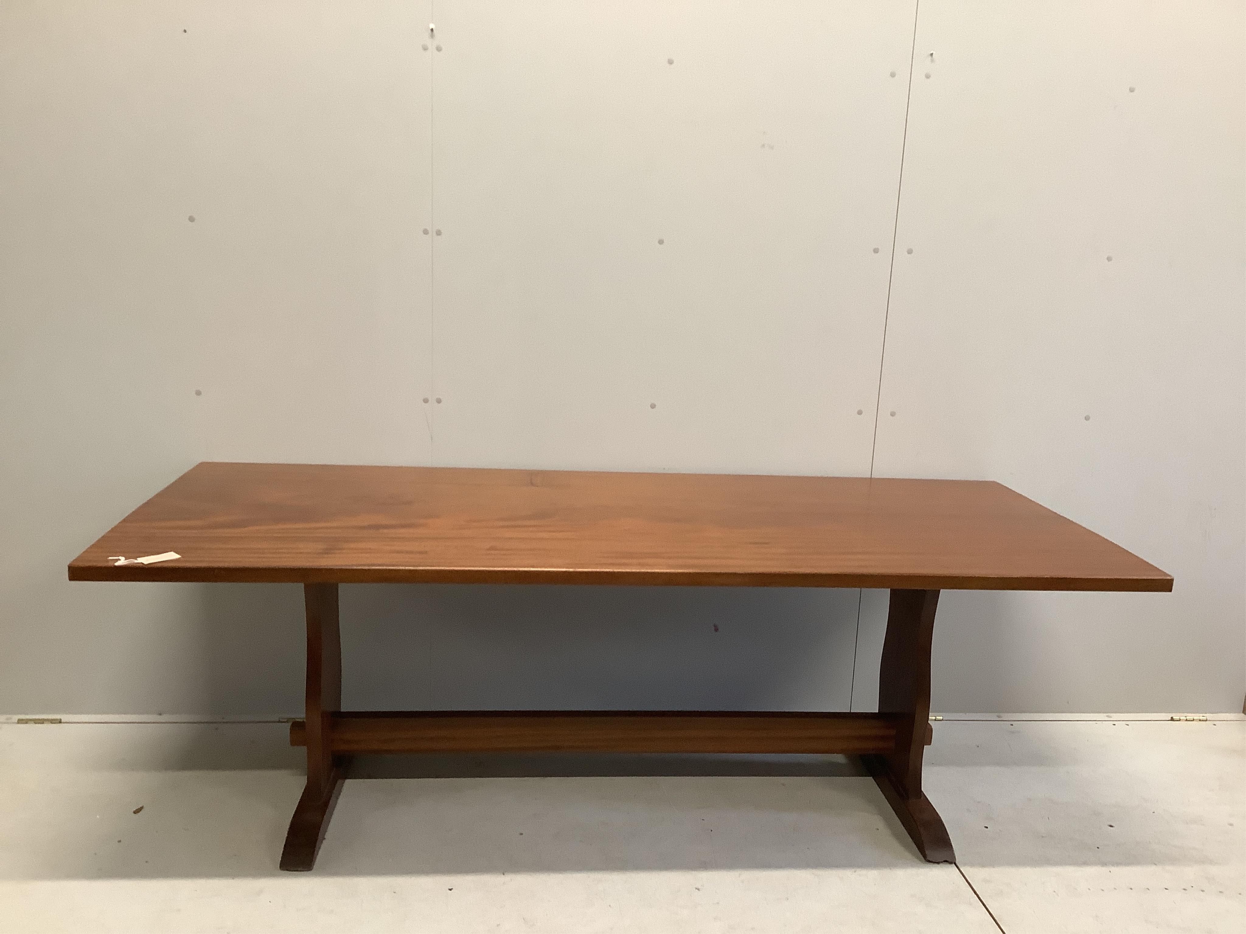 A rectangular hardwood refectory dining table, width 214cm, depth 89cm, height 71cm, together with eight early 20th century oak dining chairs. Condition - fair to good